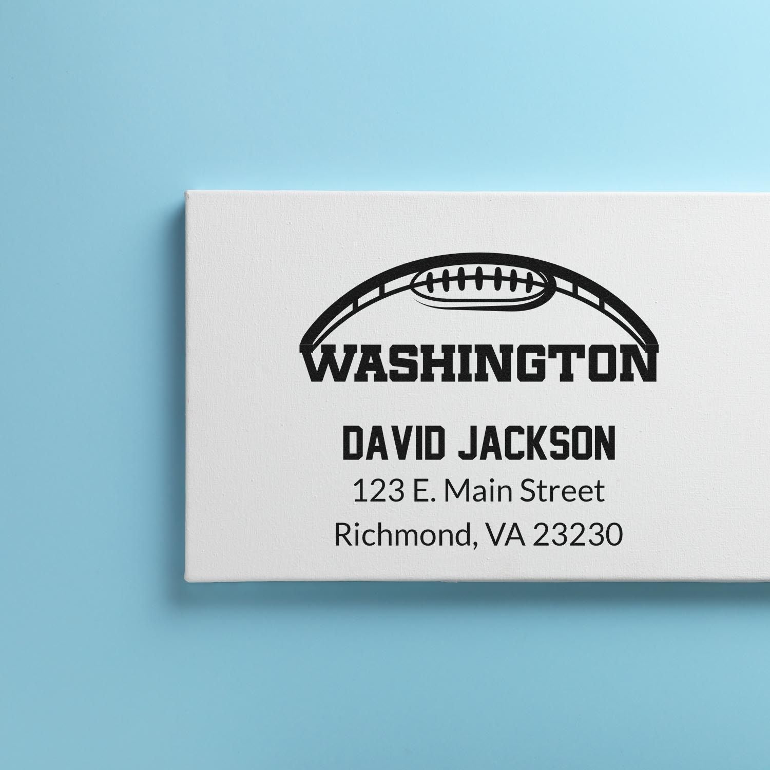 Custom return address rubber stamp with football logo, Washington text, and David Jackson, Richmond, VA address.