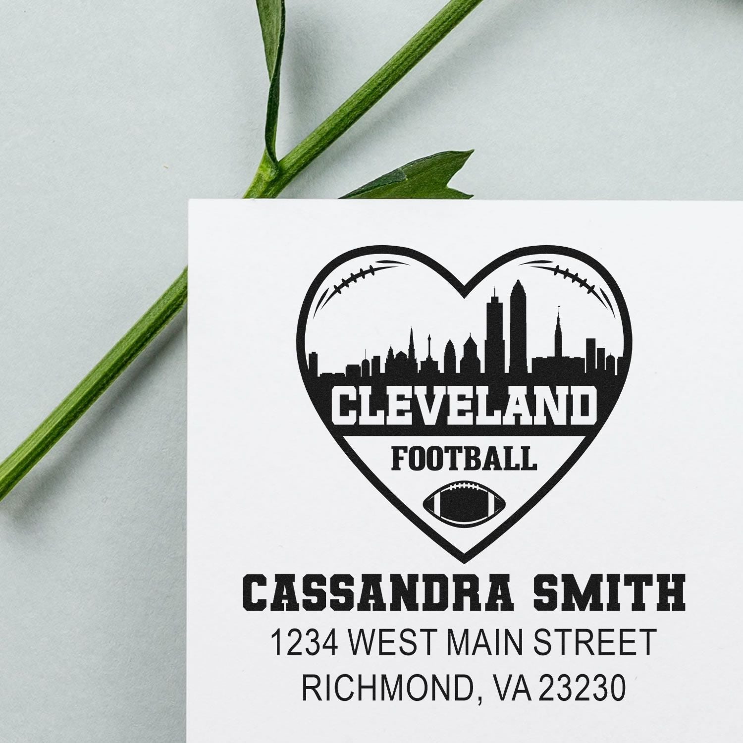 Custom rubber stamp with Cleveland football heart skyline and personalized address for Cassandra Smith, Richmond VA 23230.