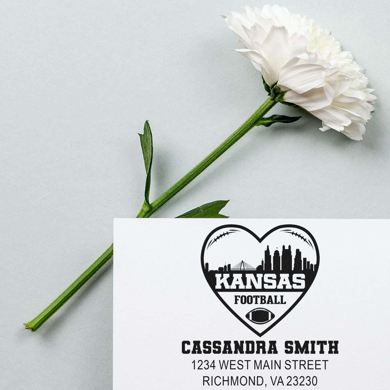 Custom Kansas football rubber stamp with name and address for Cassandra Smith, featuring a heart-shaped skyline logo.