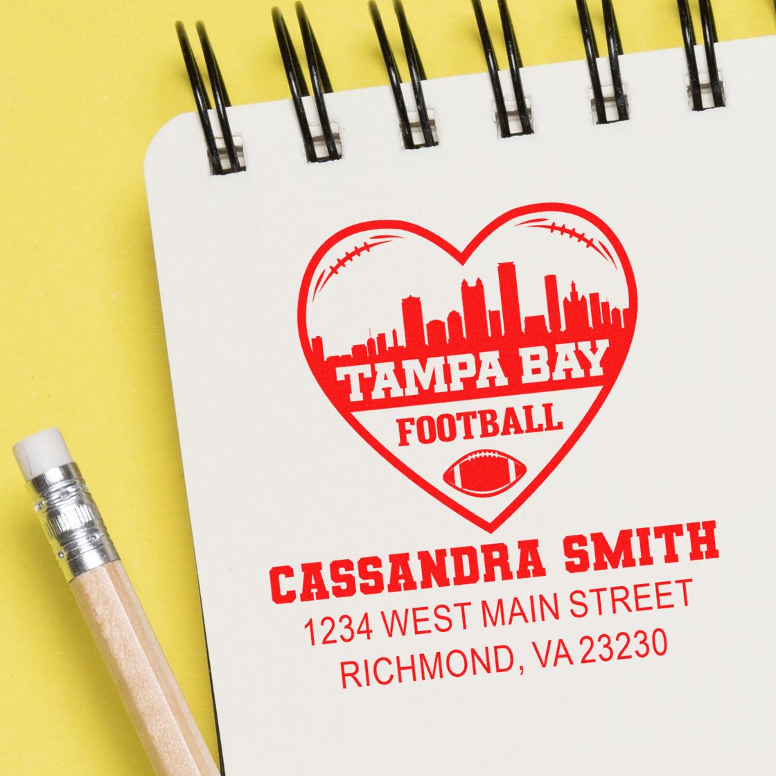 Personalized rubber stamp design for a Tampa Bay football fan with name and address on notebook paper.