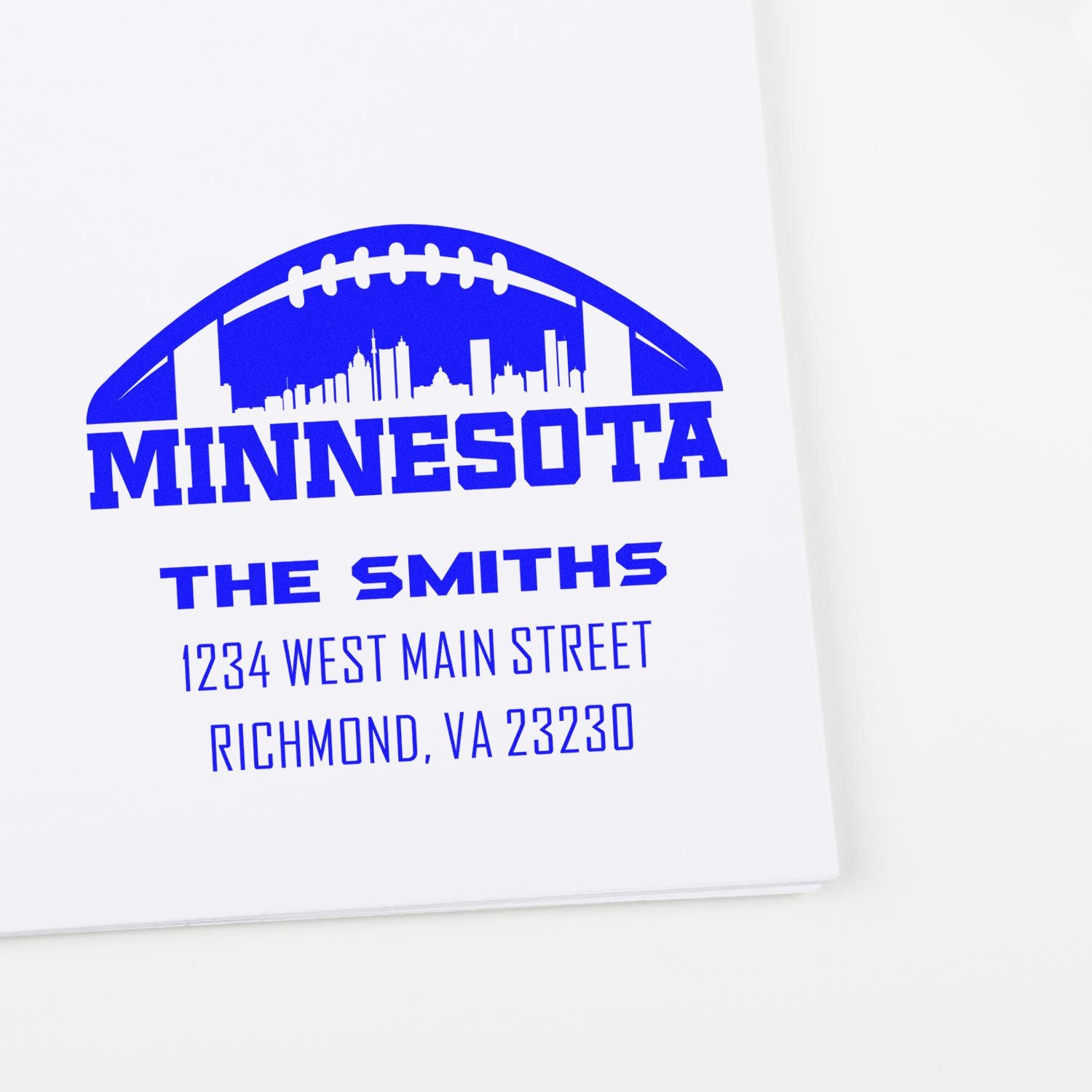 Custom Minnesota rubber stamp design with football skyline, family name, and return address for mailing use.