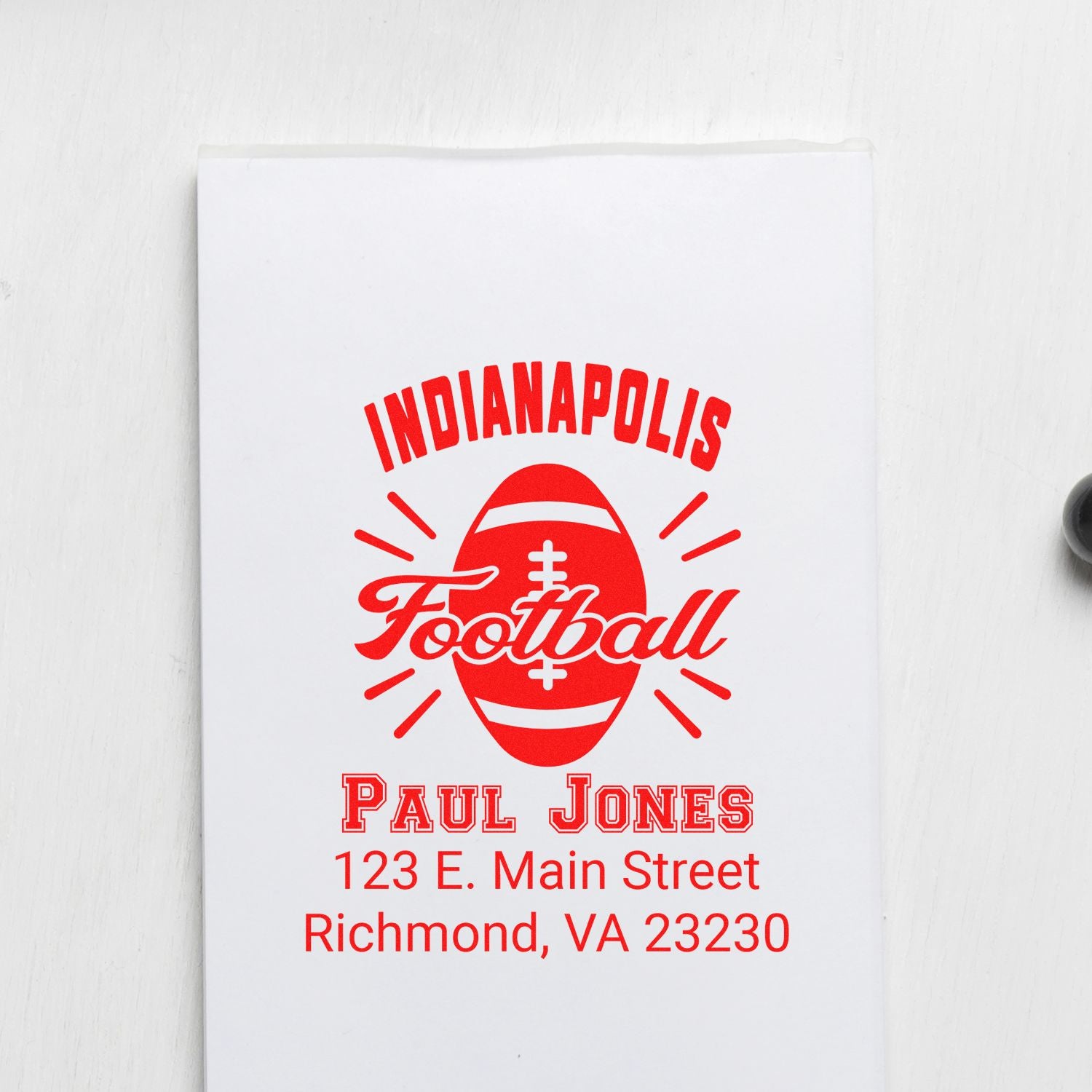 Custom rubber stamp with Indianapolis Football logo, Paul Jones name, and Richmond, VA return address in red on white paper.