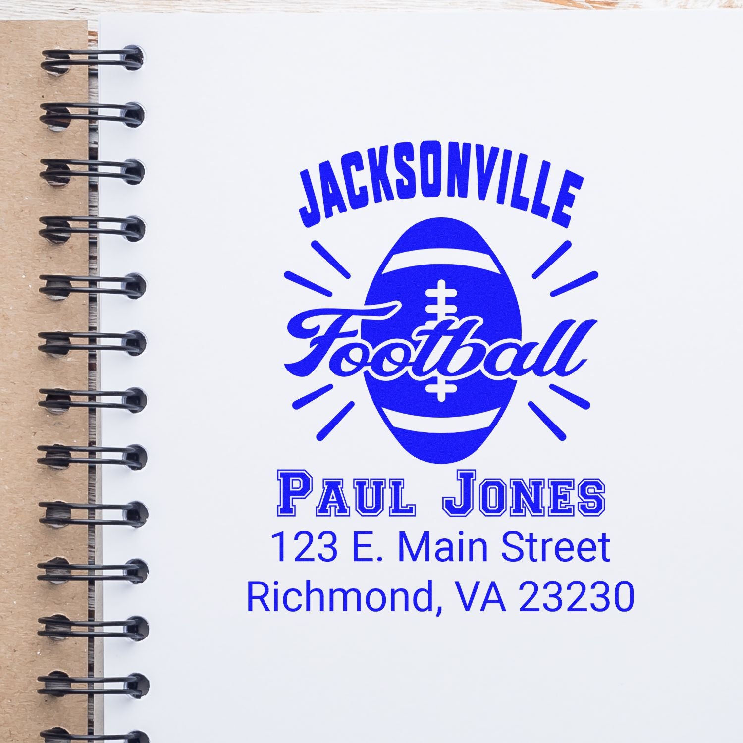 Custom Jacksonville Football rubber stamp with Paul Jones name and Richmond, VA address on a notebook page.