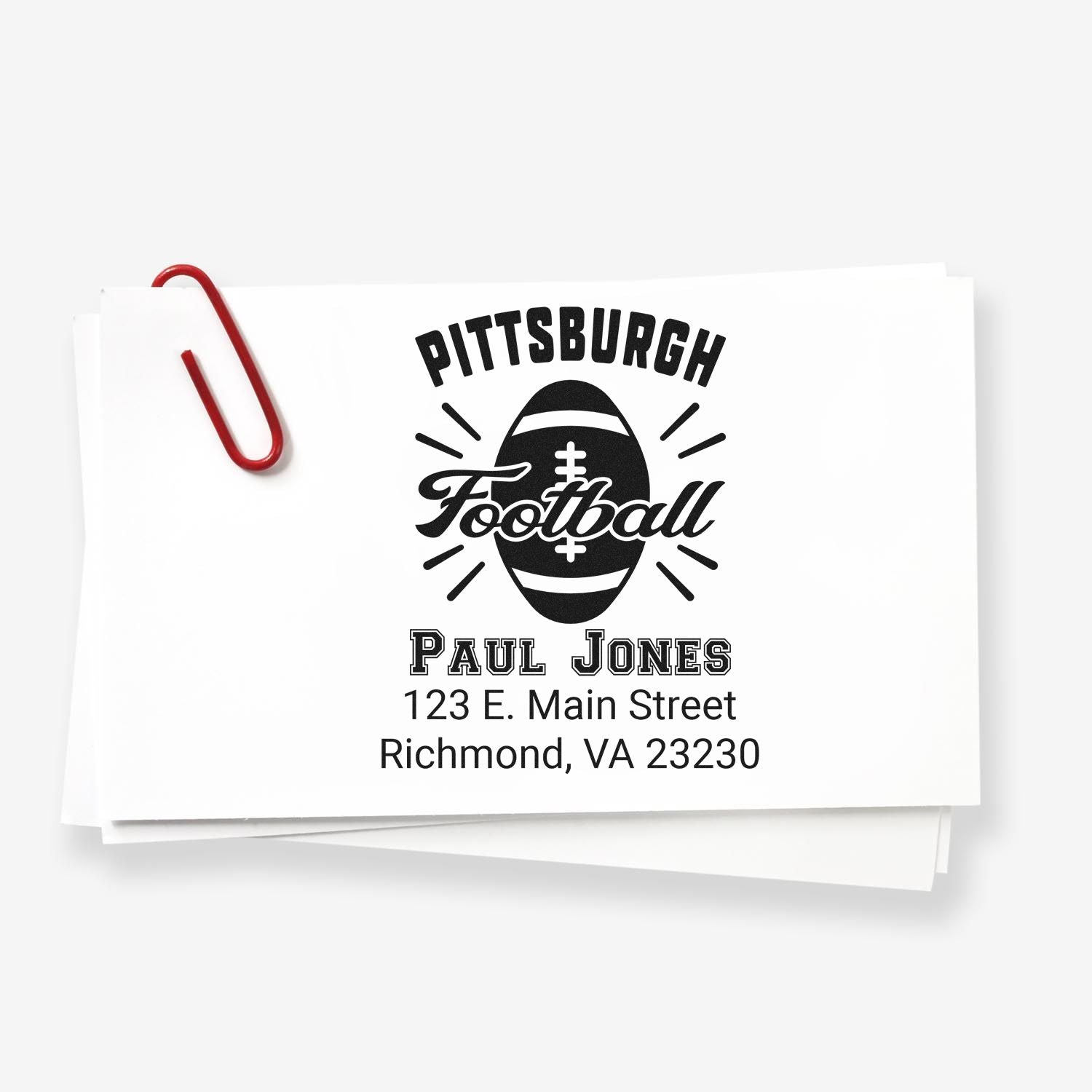 Custom Pittsburgh football rubber stamp with Paul Jones name and Richmond, VA return address on paper stack.