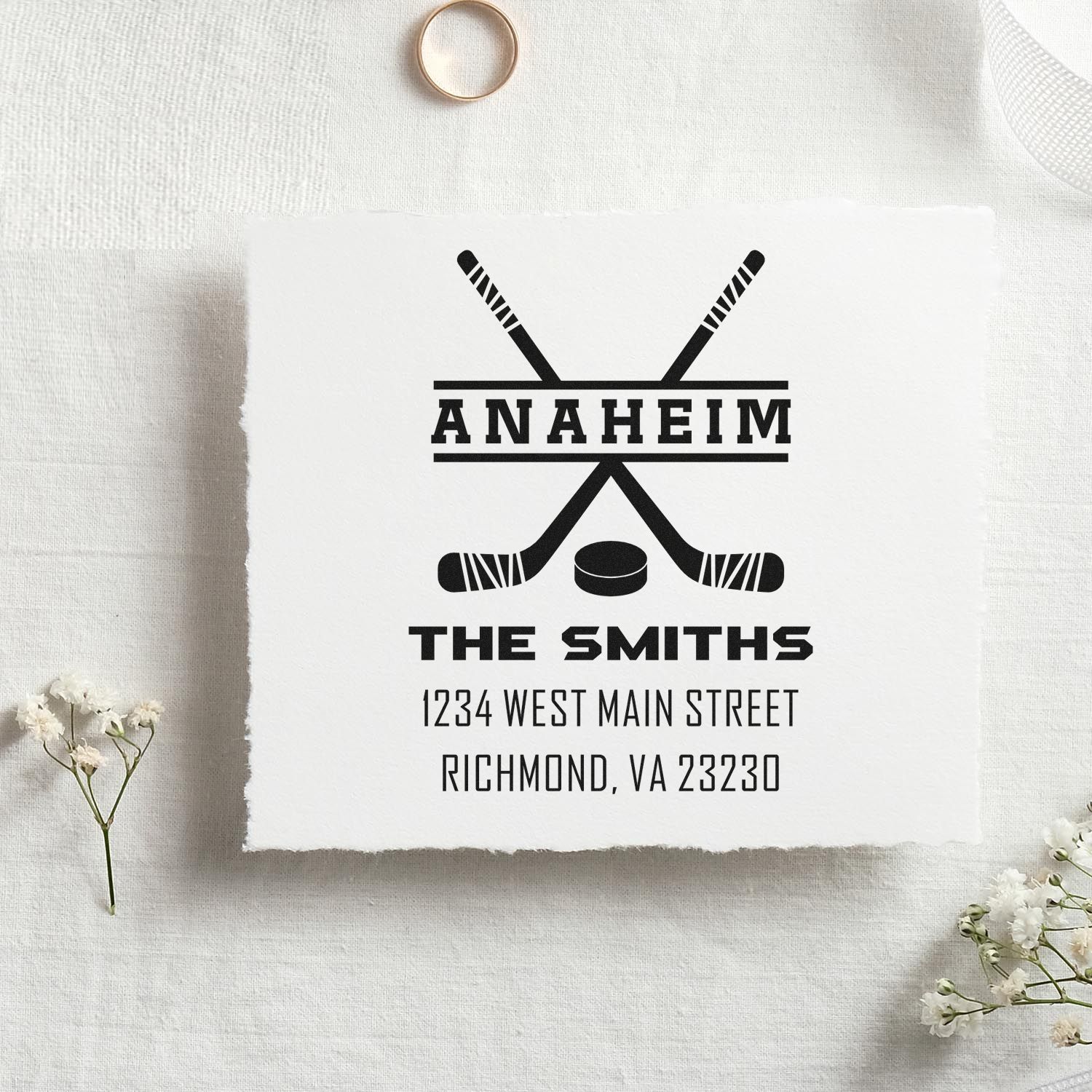 Custom hockey family address rubber stamp with crossed sticks, The Smiths, and return address in Richmond, VA 23230.