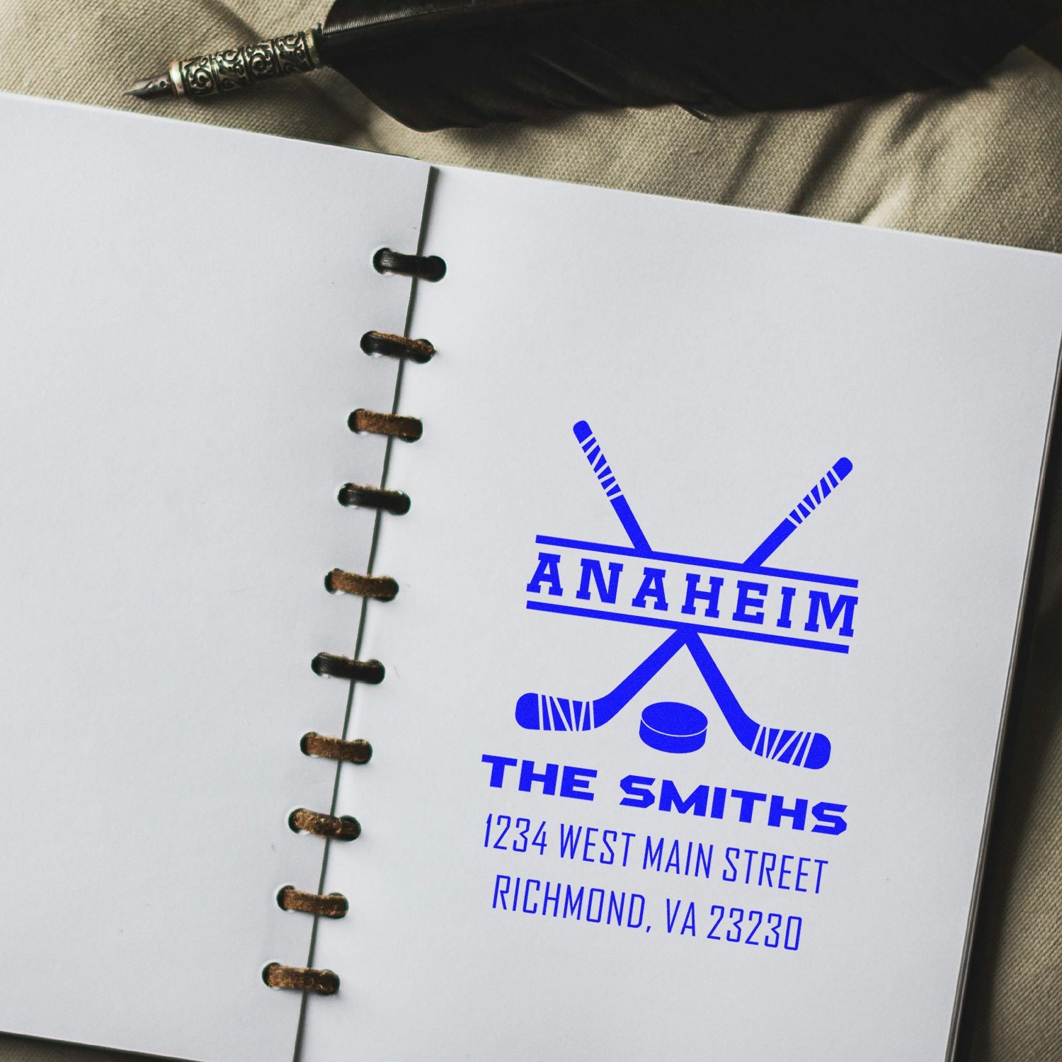 Custom rubber stamp design with Anaheim hockey logo, The Smiths, and address imprint for personalized stationery.