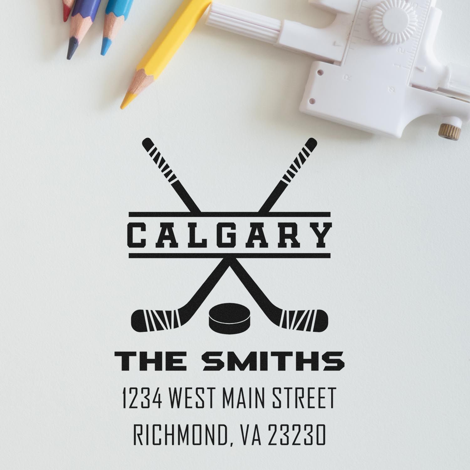 Custom hockey rubber stamp with crossed sticks, puck, and personalized family name and address for The Smiths, Richmond, VA.