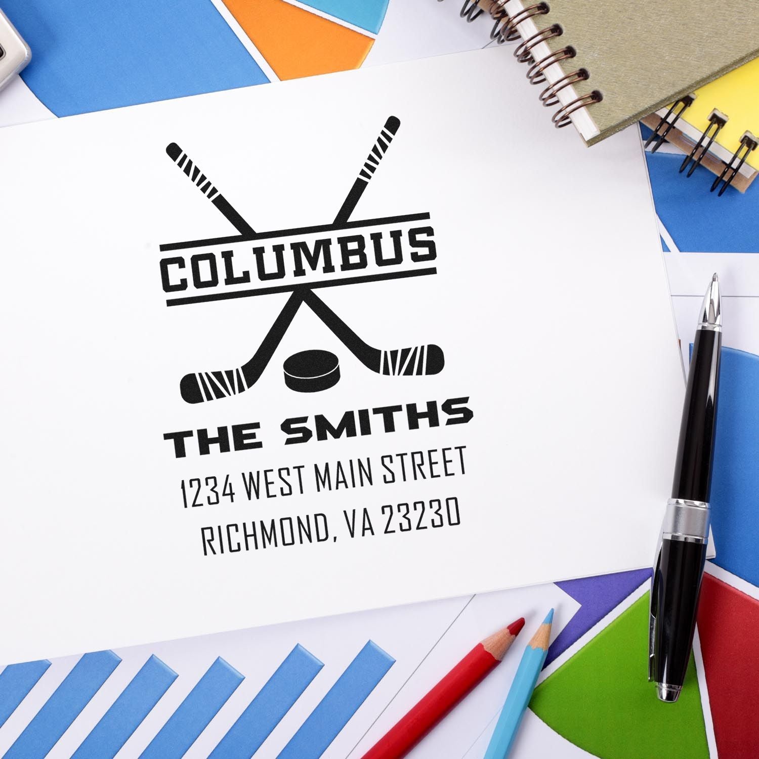 Personalized hockey return address rubber stamp for The Smiths, Columbus, with crossed sticks and puck.
