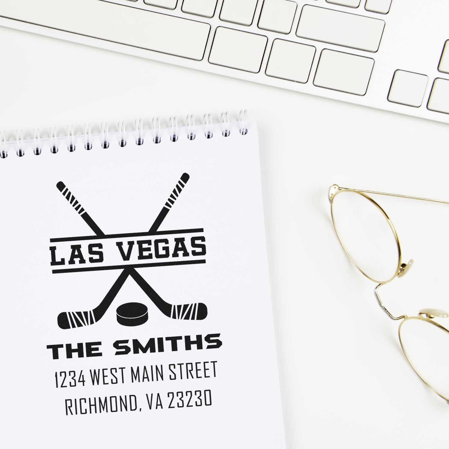 Custom rubber stamp mockup for The Smiths return address, featuring a Las Vegas hockey logo on a notebook.