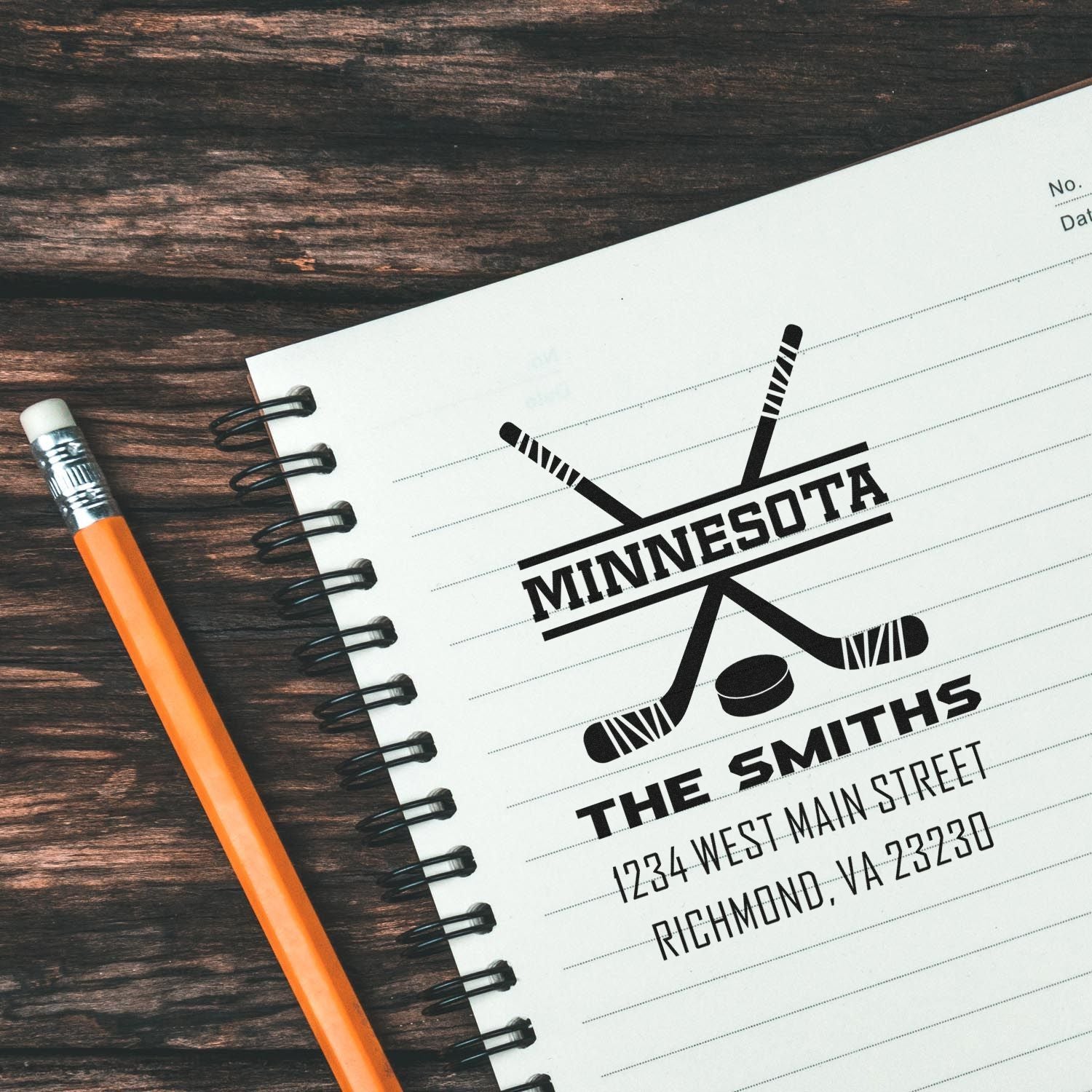 Custom Minnesota hockey return address rubber stamp with family name, crossed sticks logo, and mailing details.