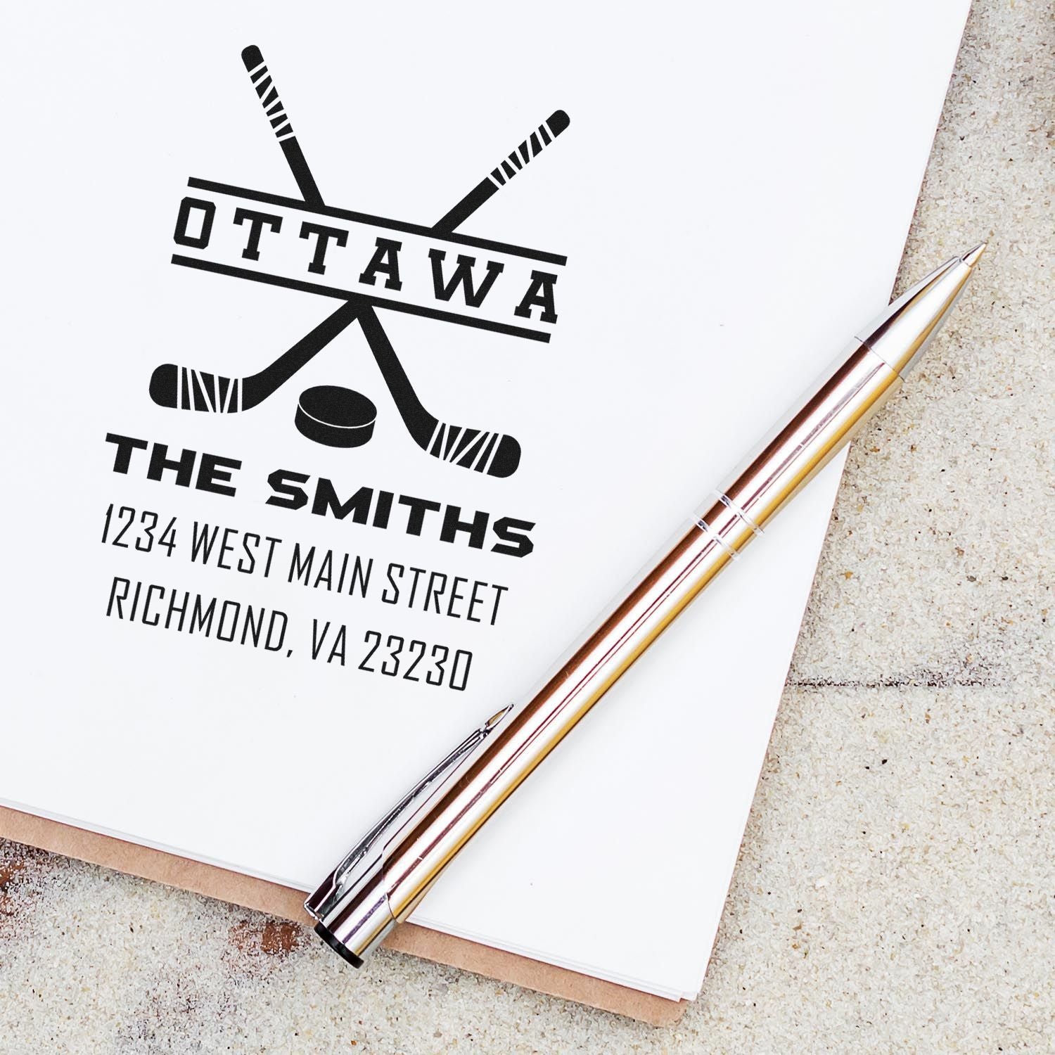 Custom Ottawa family address rubber stamp with hockey sticks and The Smiths name, ideal for personalized stationery.