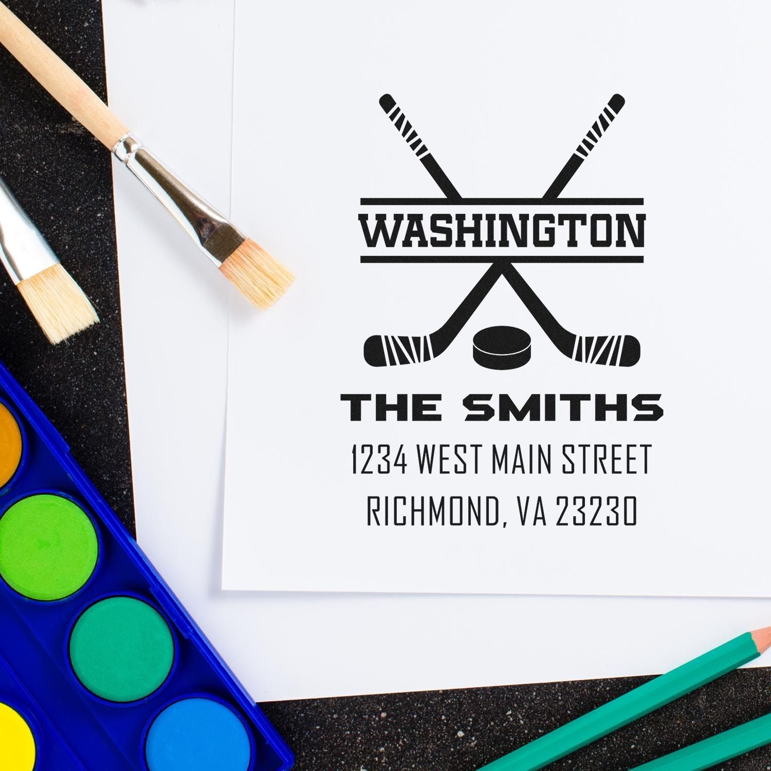 Custom hockey return address rubber stamp for The Smiths, Washington, VA 23230, with crossed sticks and puck