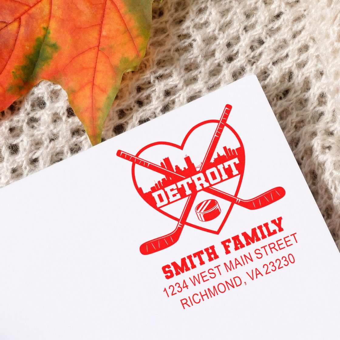 Personalized rubber stamp featuring Detroit hockey heart logo and Smith Family return address.