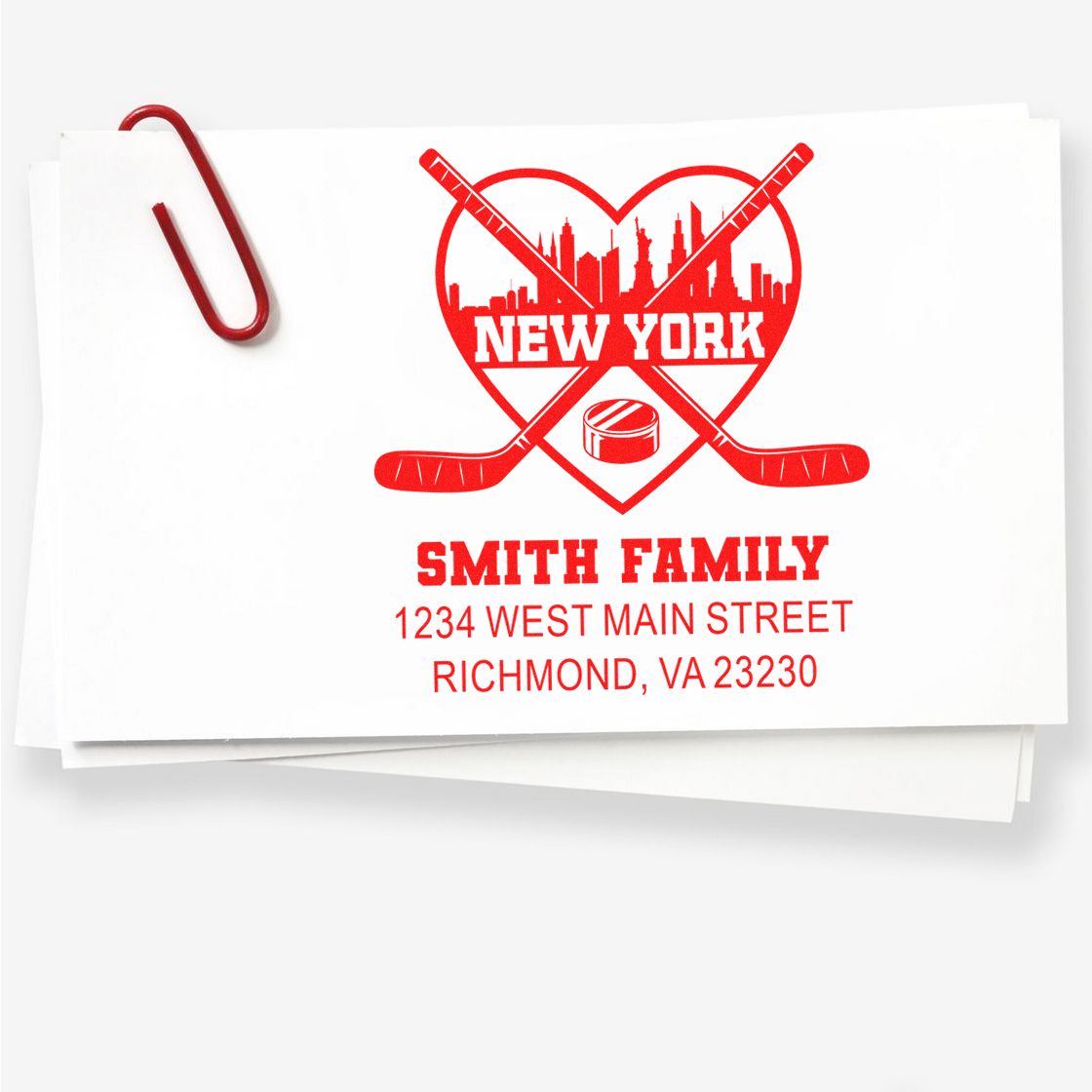 Custom rubber stamp with hockey logo, New York skyline, and Smith Family return address for personalized envelopes.