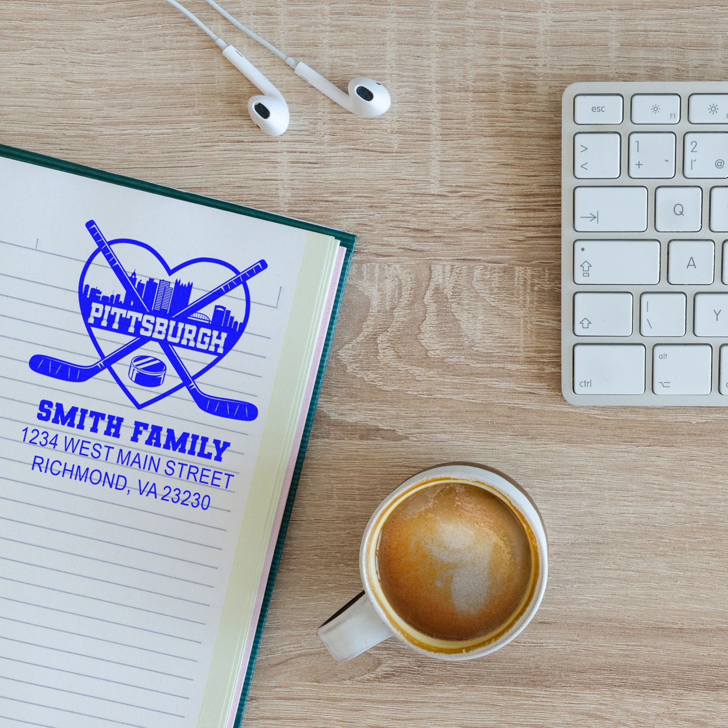 Custom Pittsburgh hockey family address rubber stamp on notebook, ideal for personalized mail and correspondence.