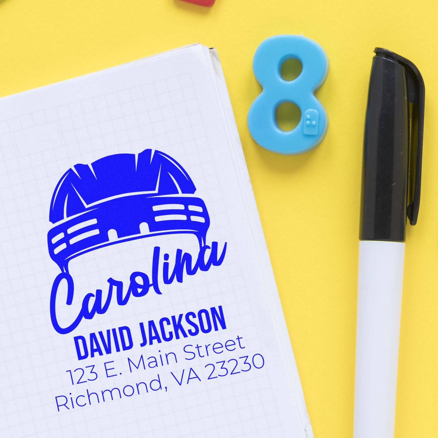 Custom rubber stamp proof for Carolina David Jackson with hardhat logo and address, ideal for contractor branding.