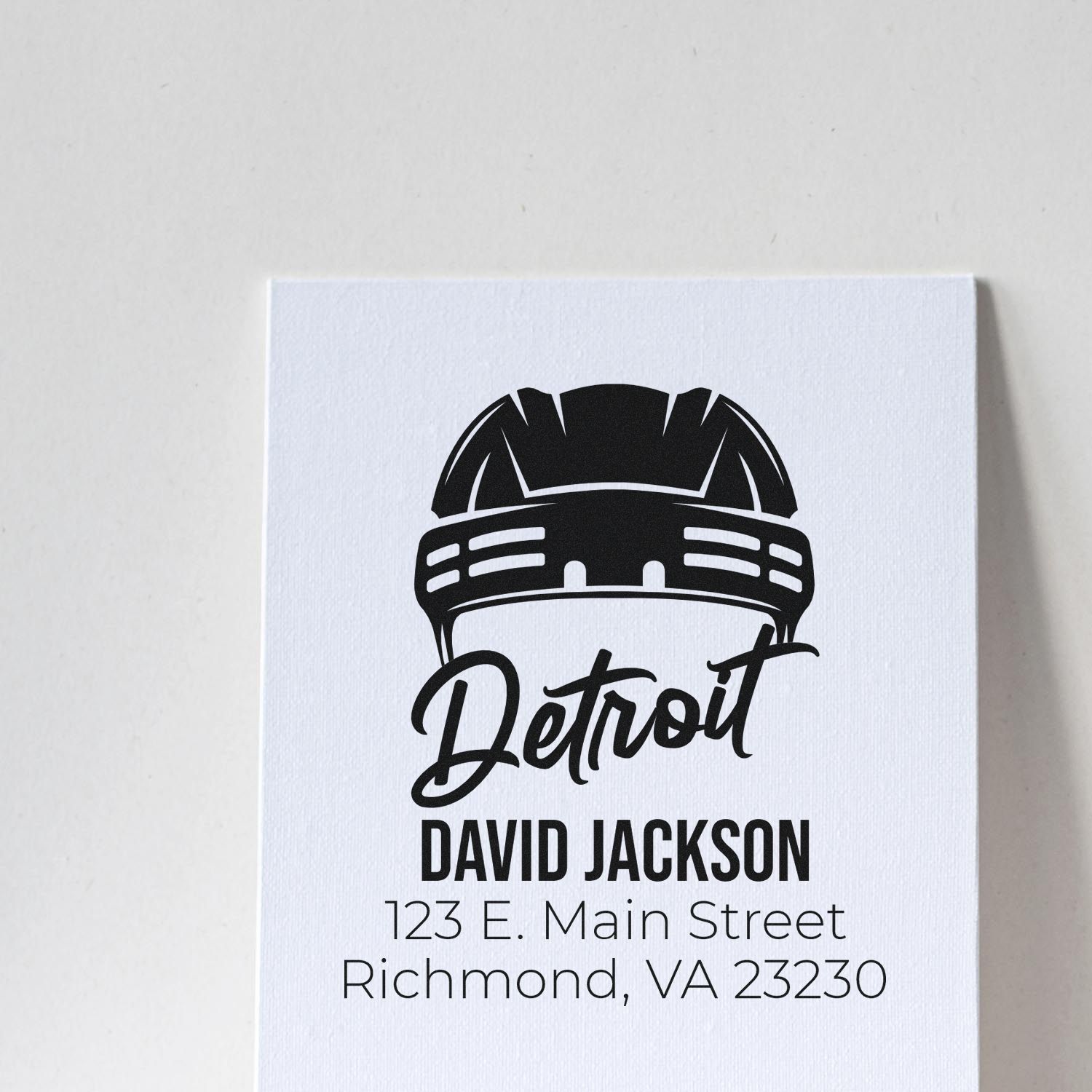 Custom Detroit rubber stamp design with helmet logo, personalized name, and Richmond, VA address.