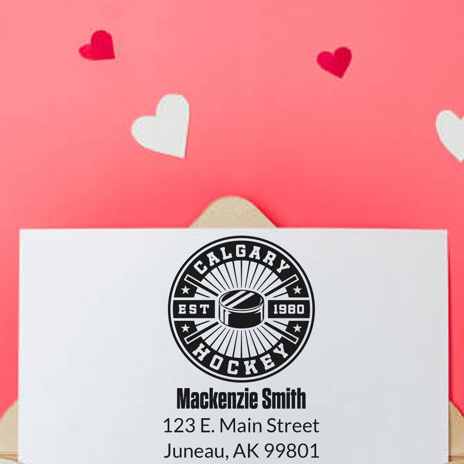 Personalized Calgary Hockey return address rubber stamp with name and address on a white envelope.