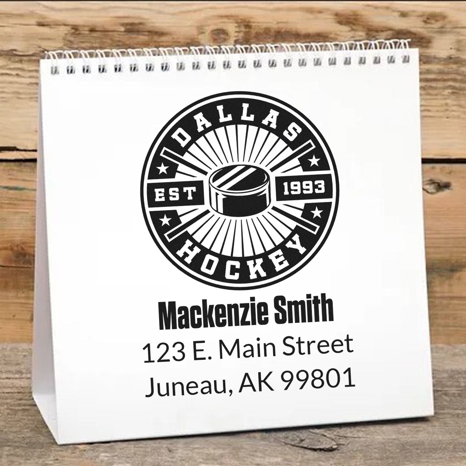 Personalized hockey return address rubber stamp with Dallas Hockey logo, custom name, and address on a gift bag.