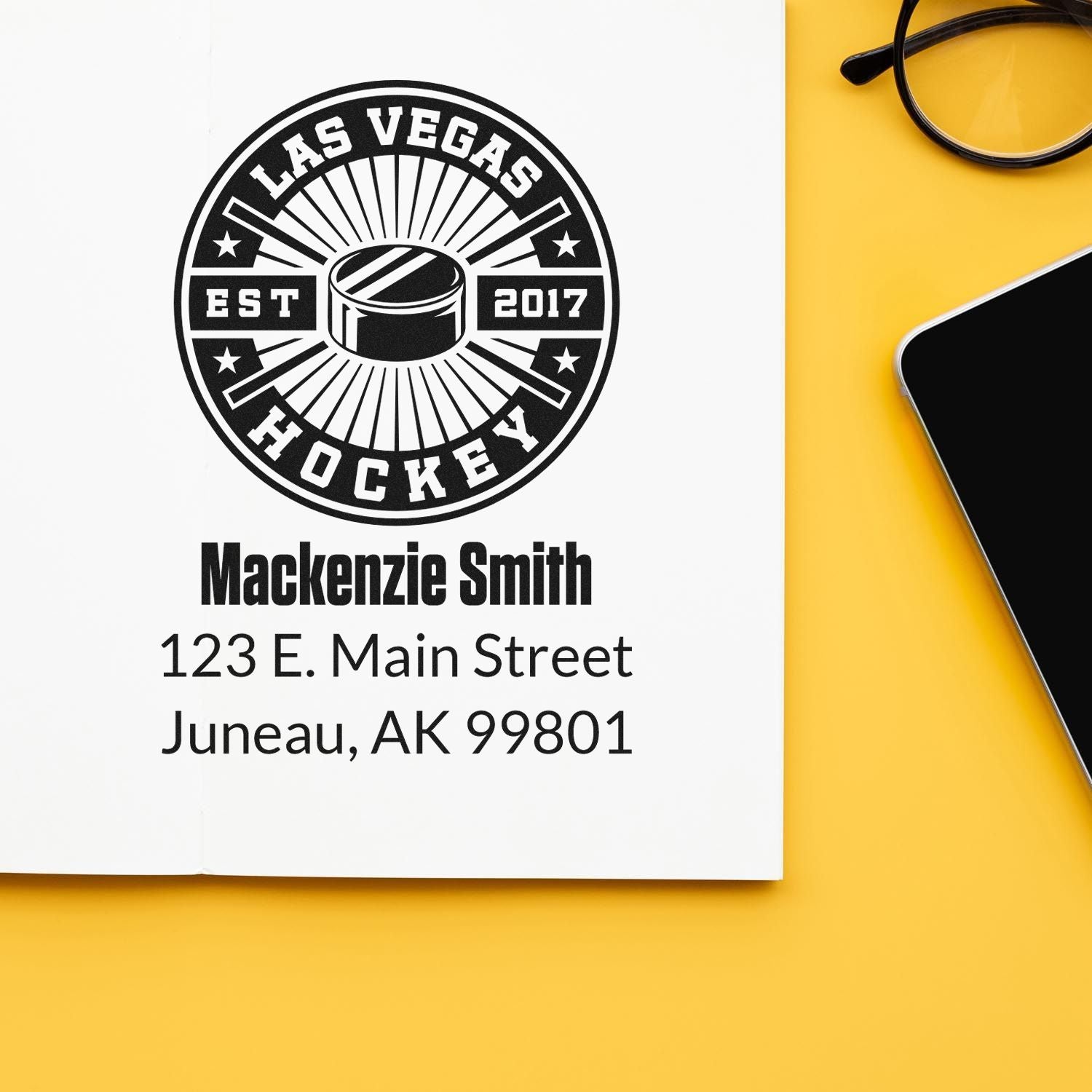 Personalized hockey rubber stamp with Las Vegas Hockey logo, name, and Juneau, AK address on paper.