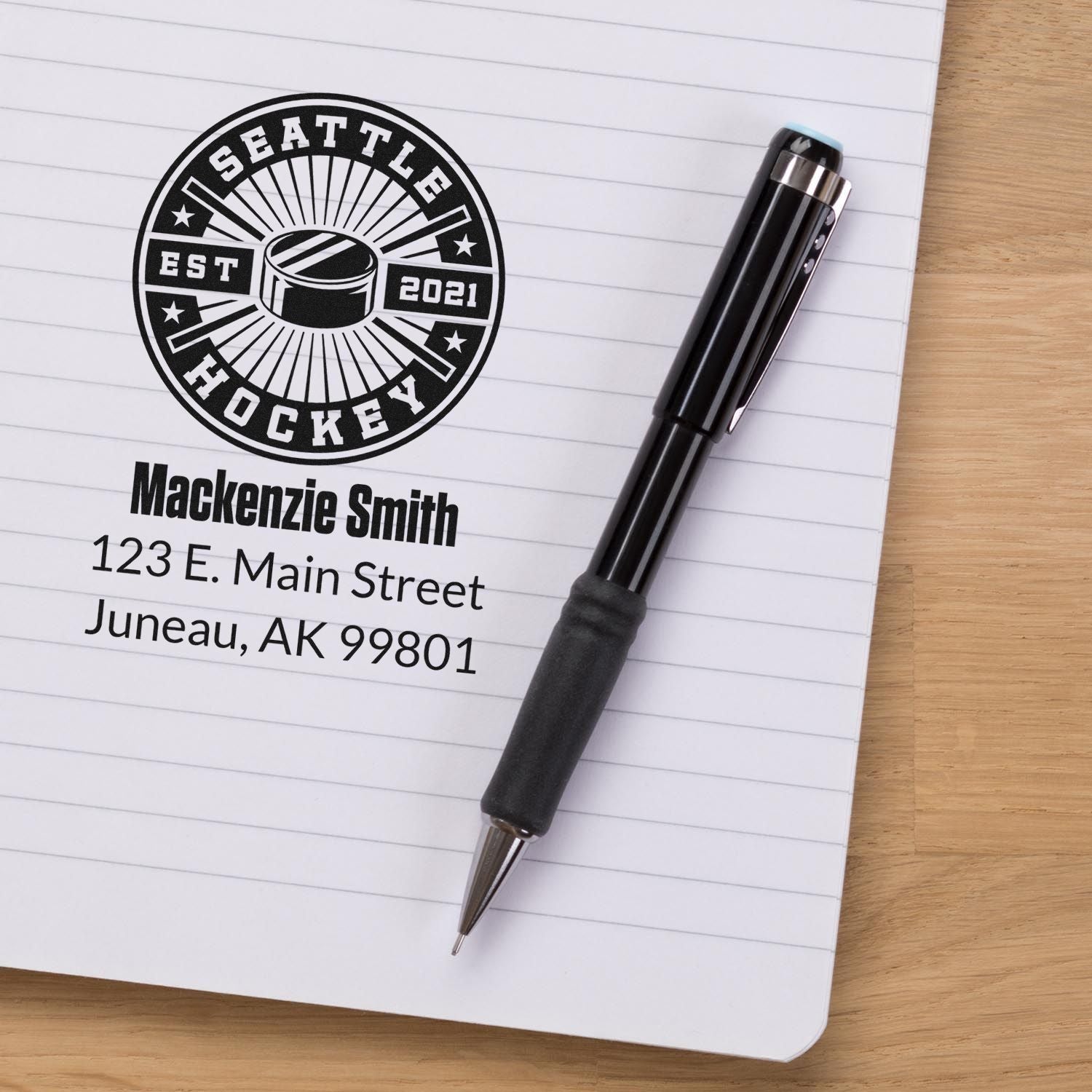 Custom hockey return address rubber stamp for MacKenzie Smith, Juneau AK, with Seattle Hockey logo.