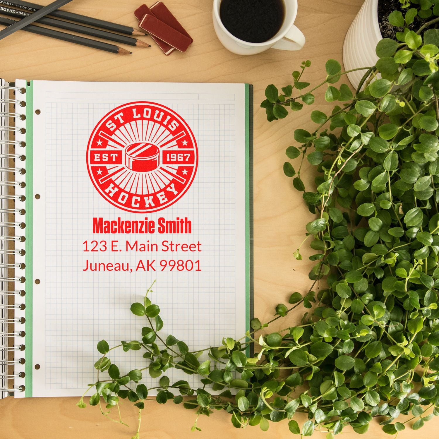Custom hockey rubber stamp design with St. Louis Hockey logo, name, and return address on a notebook.