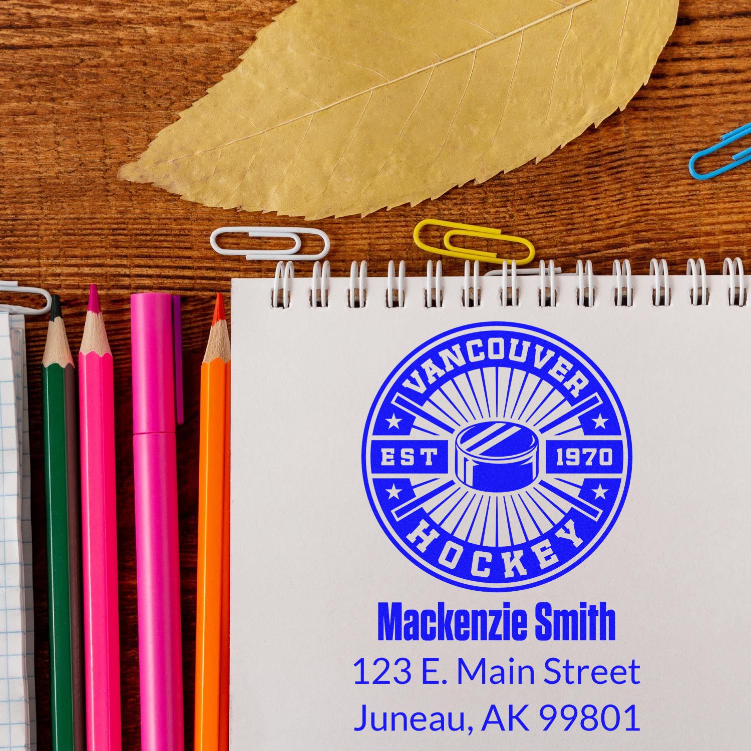 Custom hockey rubber stamp imprint on notebook with name and address, ideal for personalized stationery branding.