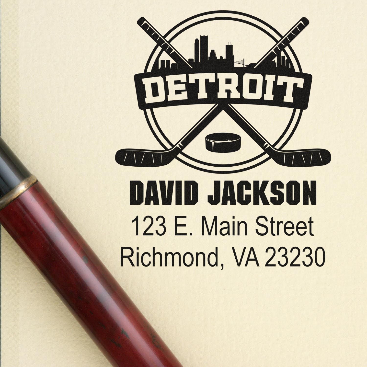 Custom Detroit hockey rubber stamp with crossed sticks, skyline, and return address for David Jackson, Richmond VA 23230.