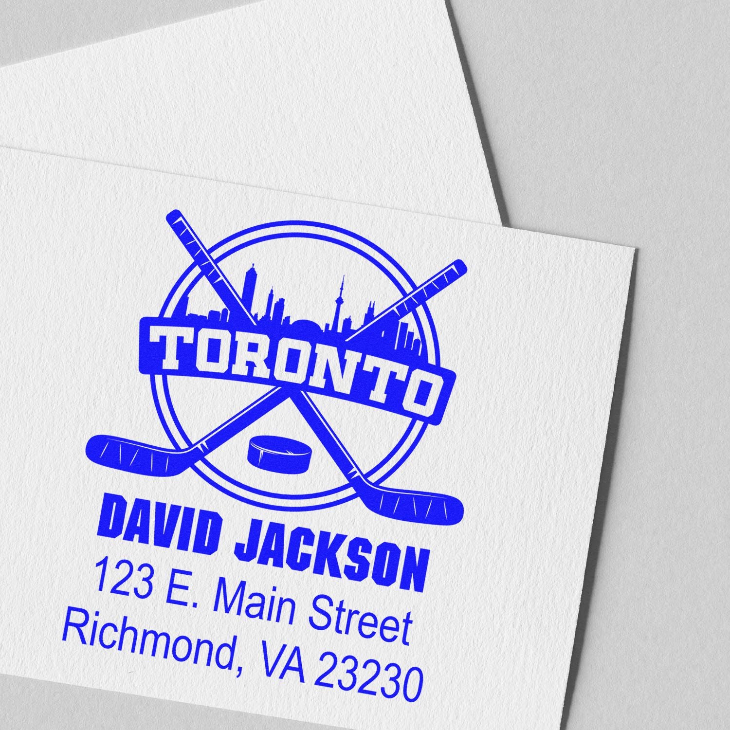 Custom Toronto hockey return address rubber stamp with crossed sticks, David Jackson name, and address.