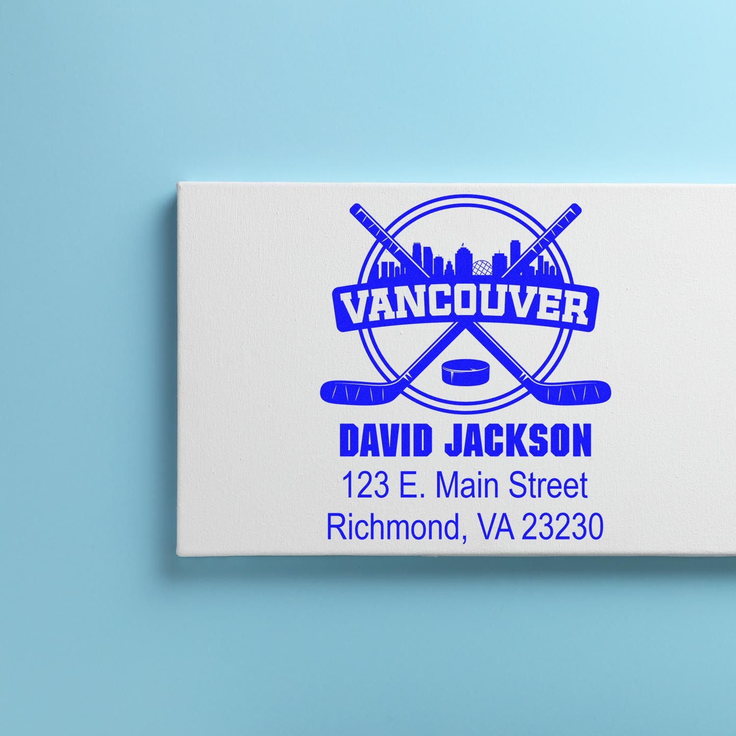 Custom hockey rubber stamp with Vancouver skyline, personalized name, and address for mailing or branding.