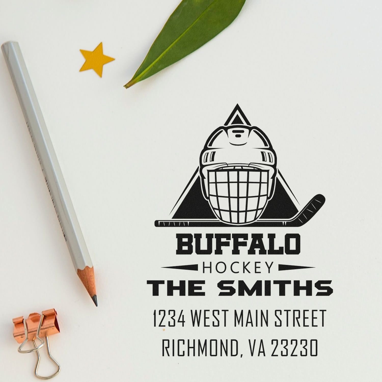 Custom Buffalo hockey rubber stamp with goalie logo, family name, and address on stationery mockup.