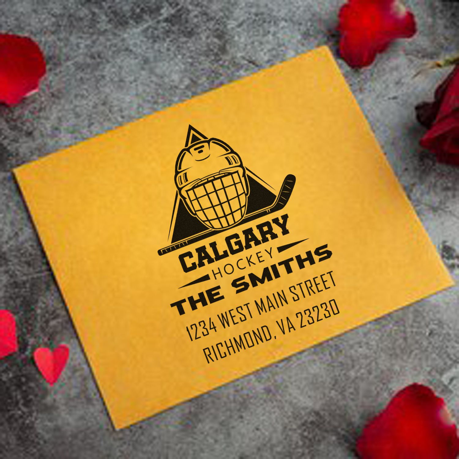 Custom Calgary hockey rubber stamp on a yellow envelope with goalie logo and personalized return address for The Smiths.