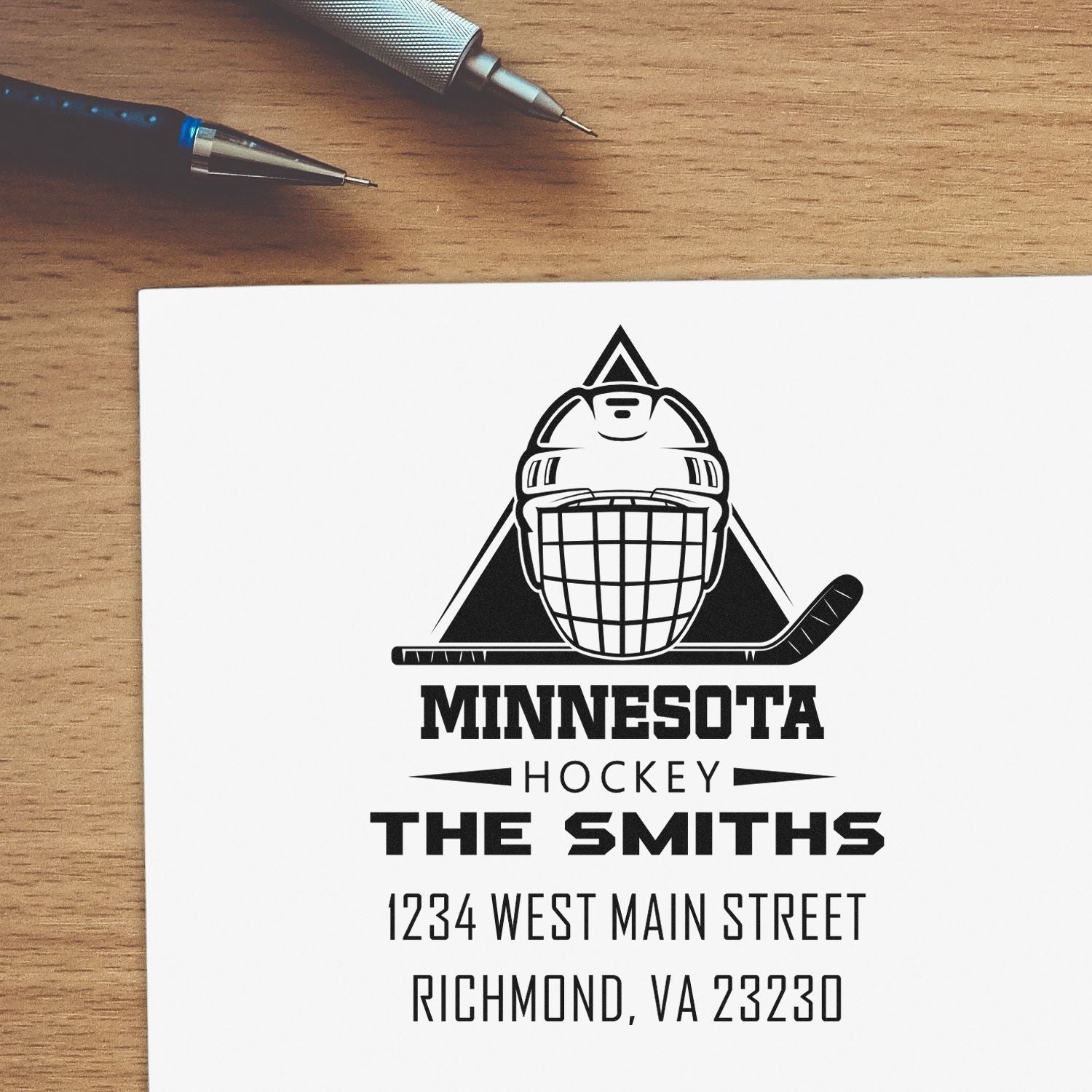Custom rubber stamp with Minnesota hockey goalie logo, The Smiths name, and address for personalized return mail.