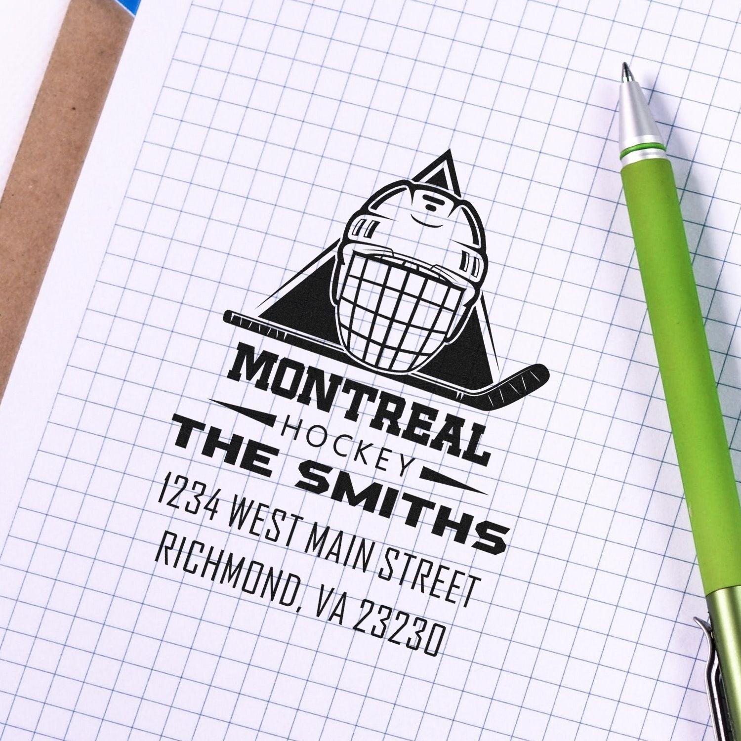 Custom rubber address stamp mockup for Montreal Hockey The Smiths, with logo and Richmond, VA address on graph paper.