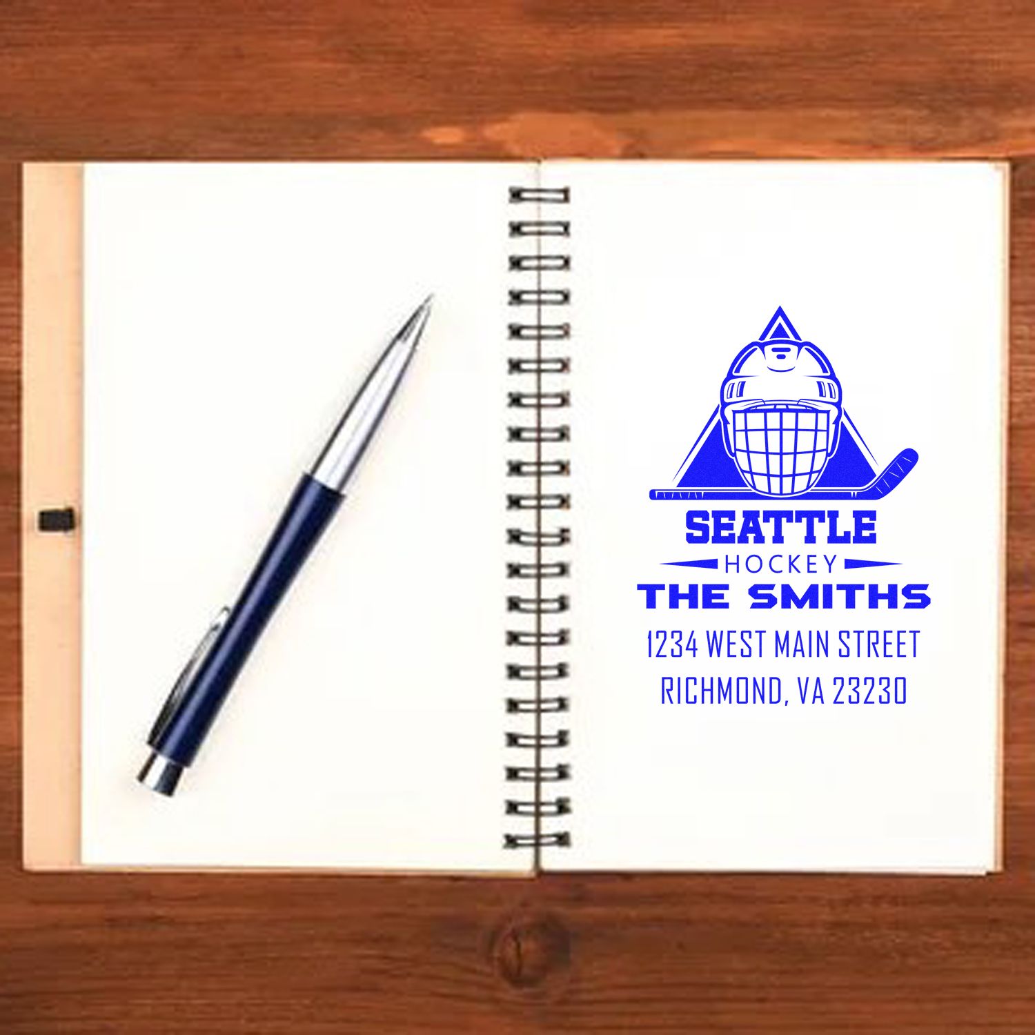 Personalized Seattle hockey rubber stamp with logo, name, and address for custom stationery and business use.