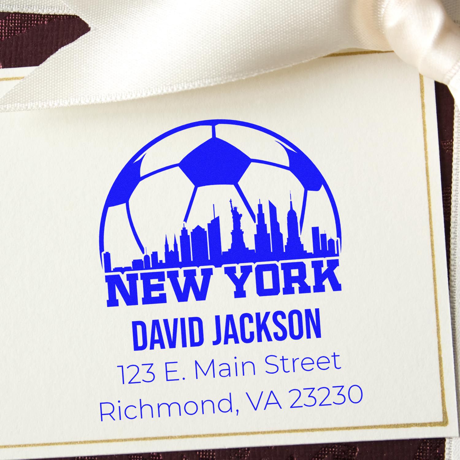Custom rubber stamp with New York skyline soccer logo, David Jackson return address, Richmond VA 23230.
