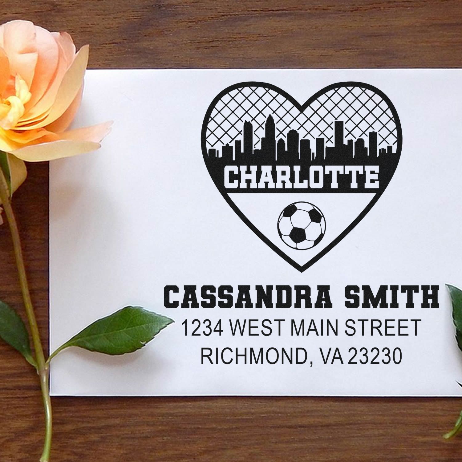 Custom rubber stamp design with Charlotte skyline heart and soccer ball for Cassandra Smith, Richmond VA return address.