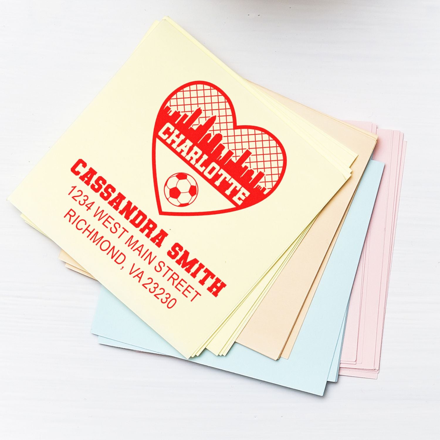 Custom rubber stamp imprint with name, address and heart design on stationery cards for Cassandra Smith.