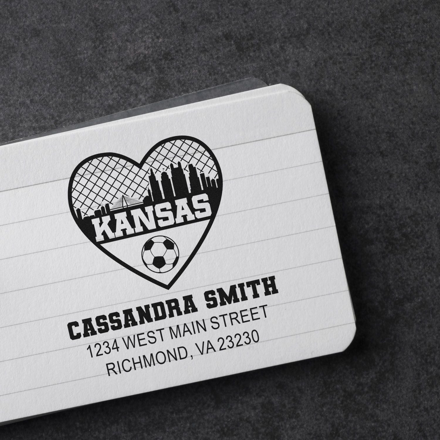 Custom Kansas rubber stamp with heart skyline, soccer ball, and personalized address for Cassandra Smith.