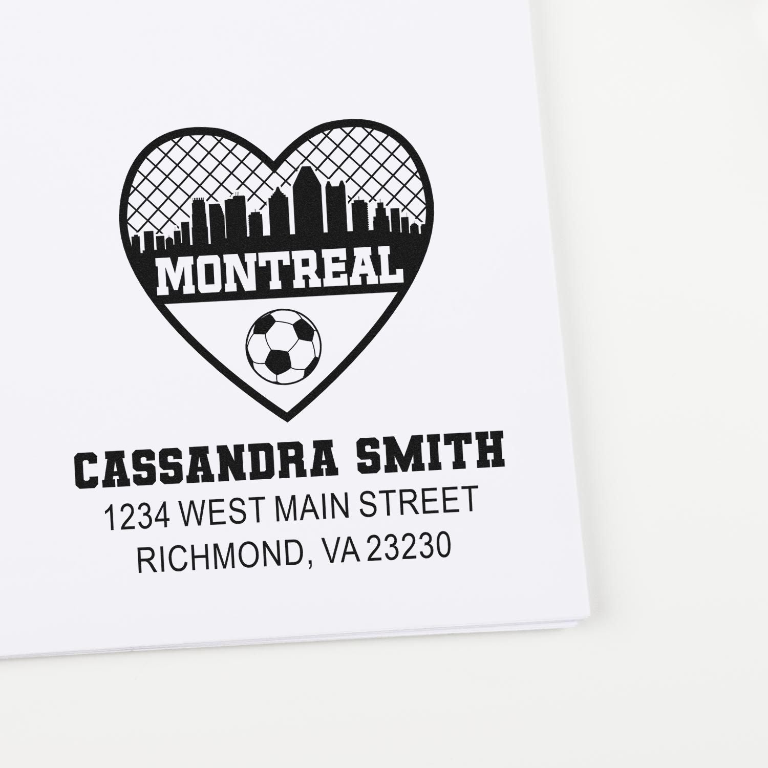 Custom return address rubber stamp with Montreal skyline heart, soccer ball, and personalized name and address.