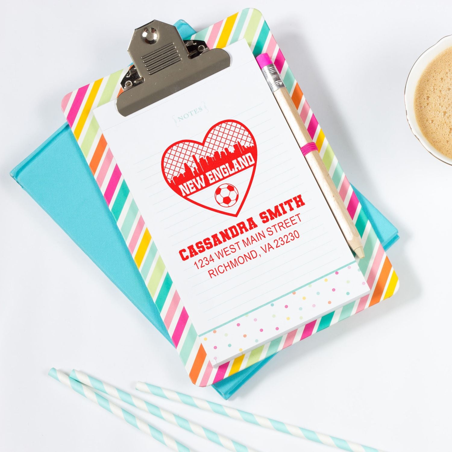 Personalized rubber stamp design with New England heart, name, and address on notepad sample.