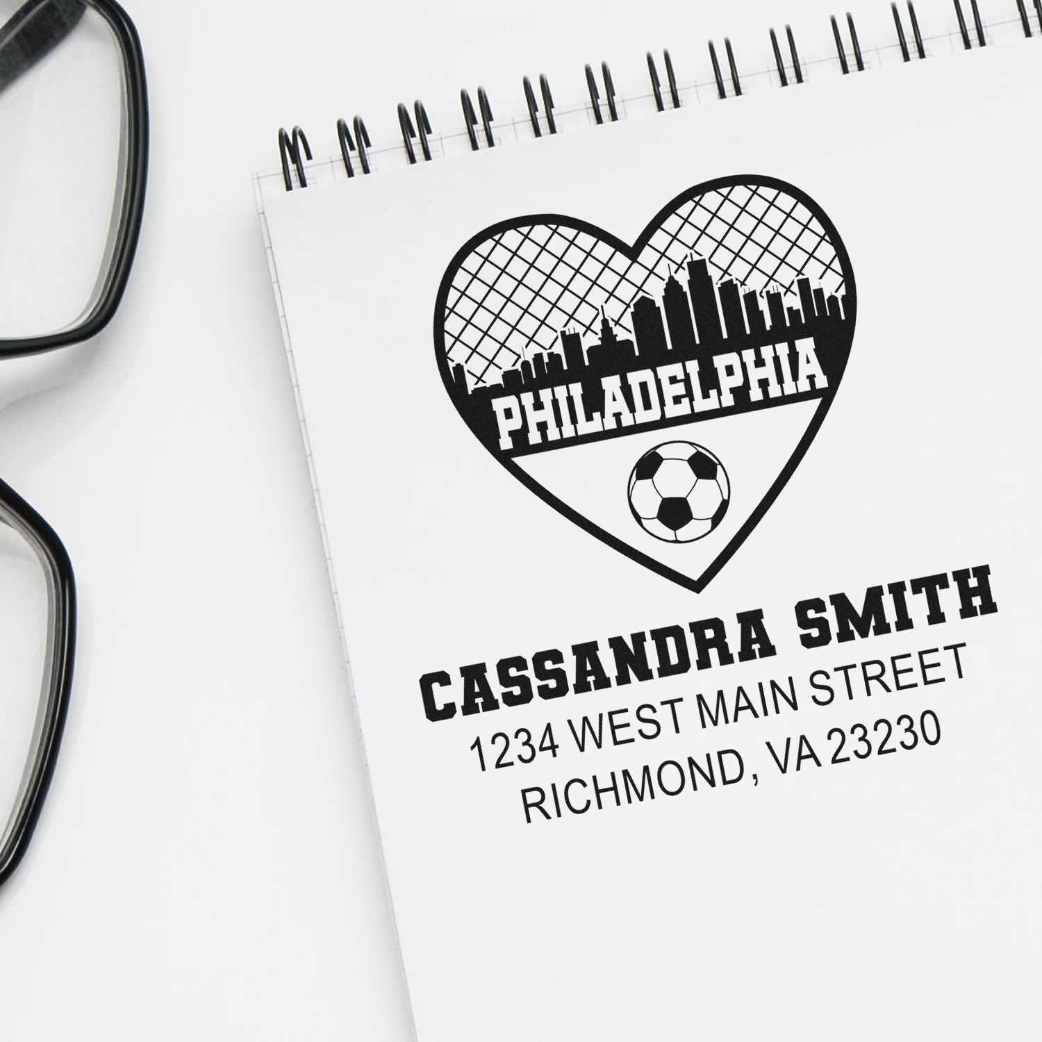 Custom return address rubber stamp with Philadelphia skyline heart, soccer ball, and Cassandra Smith Richmond, VA address.