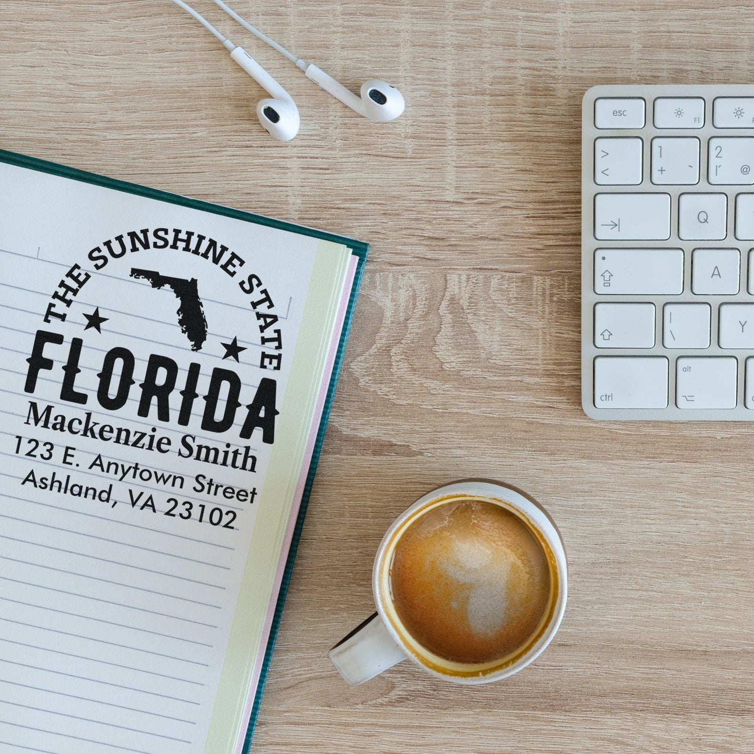 Custom Florida address rubber stamp on notebook page, showing a personalized return address stamp for home or business use.
