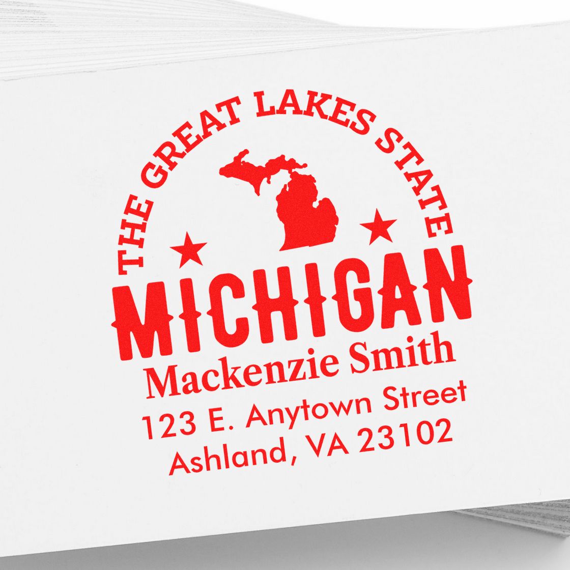 Custom Michigan return address rubber stamp with Great Lakes State design, name, and address in red imprint.