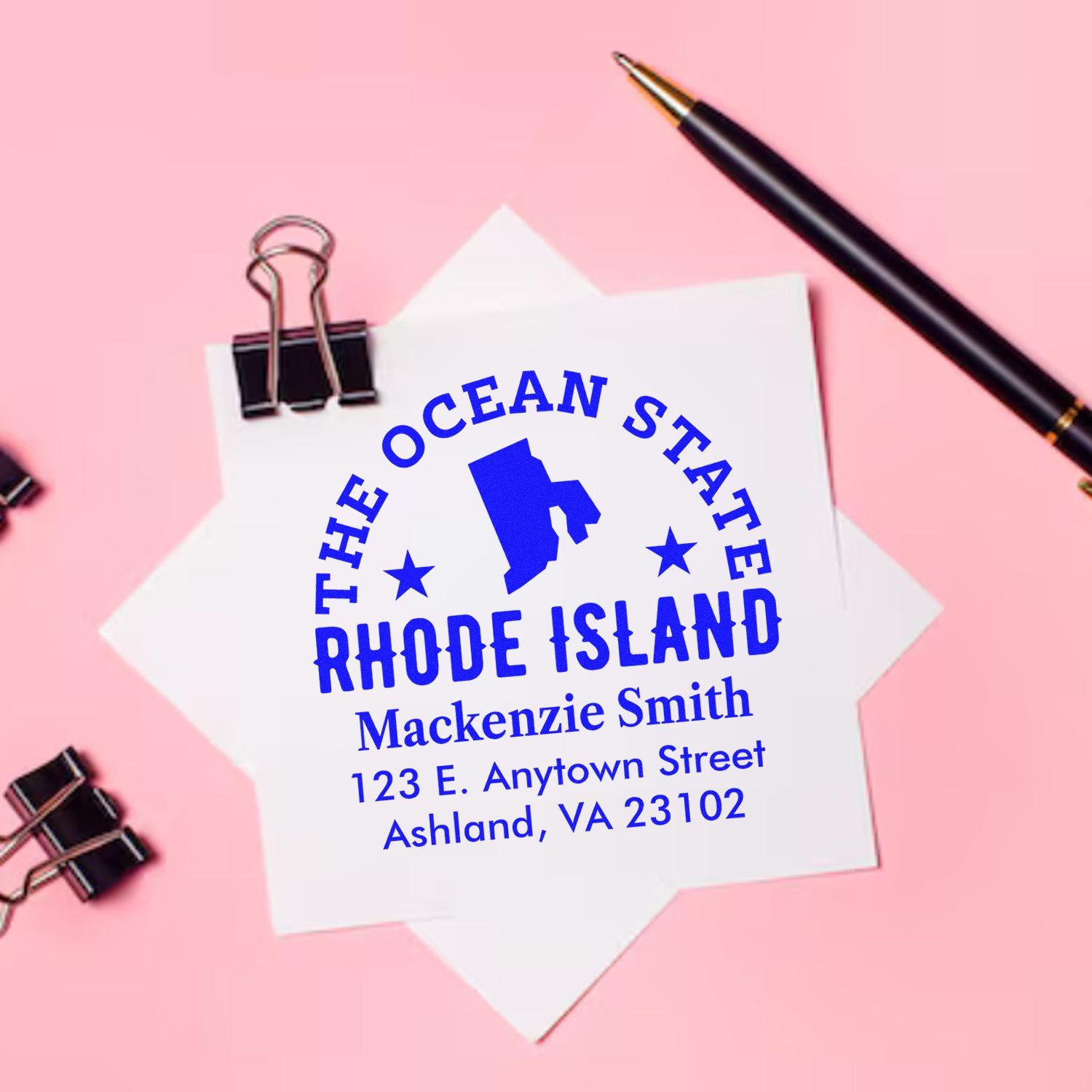 Custom Rhode Island return address rubber stamp with personalized name and mailing address on paper.