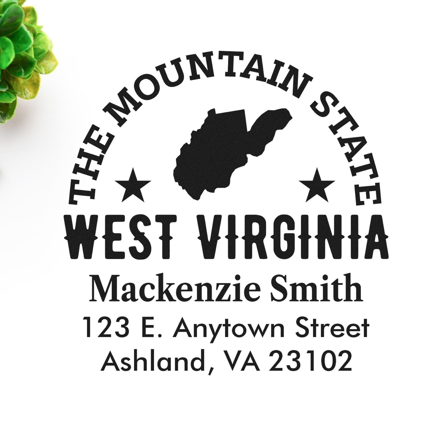 Custom West Virginia rubber stamp with The Mountain State design, name, and address for personalized return address stamping.
