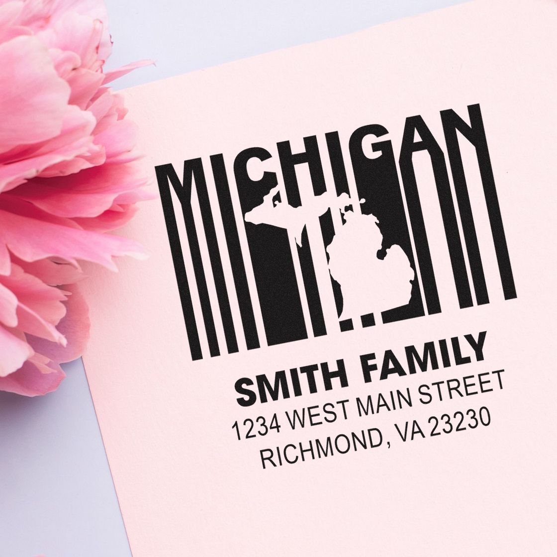 Custom Michigan return address rubber stamp with family name and mailing address for personalized envelopes.