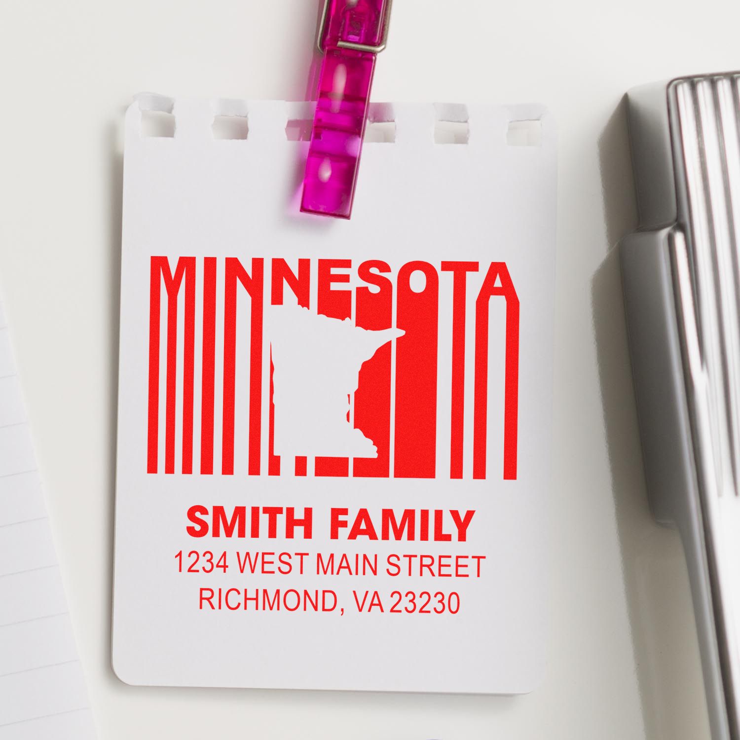 Custom Minnesota address rubber stamp with family name, state silhouette, and mailing address for personalized correspondence.