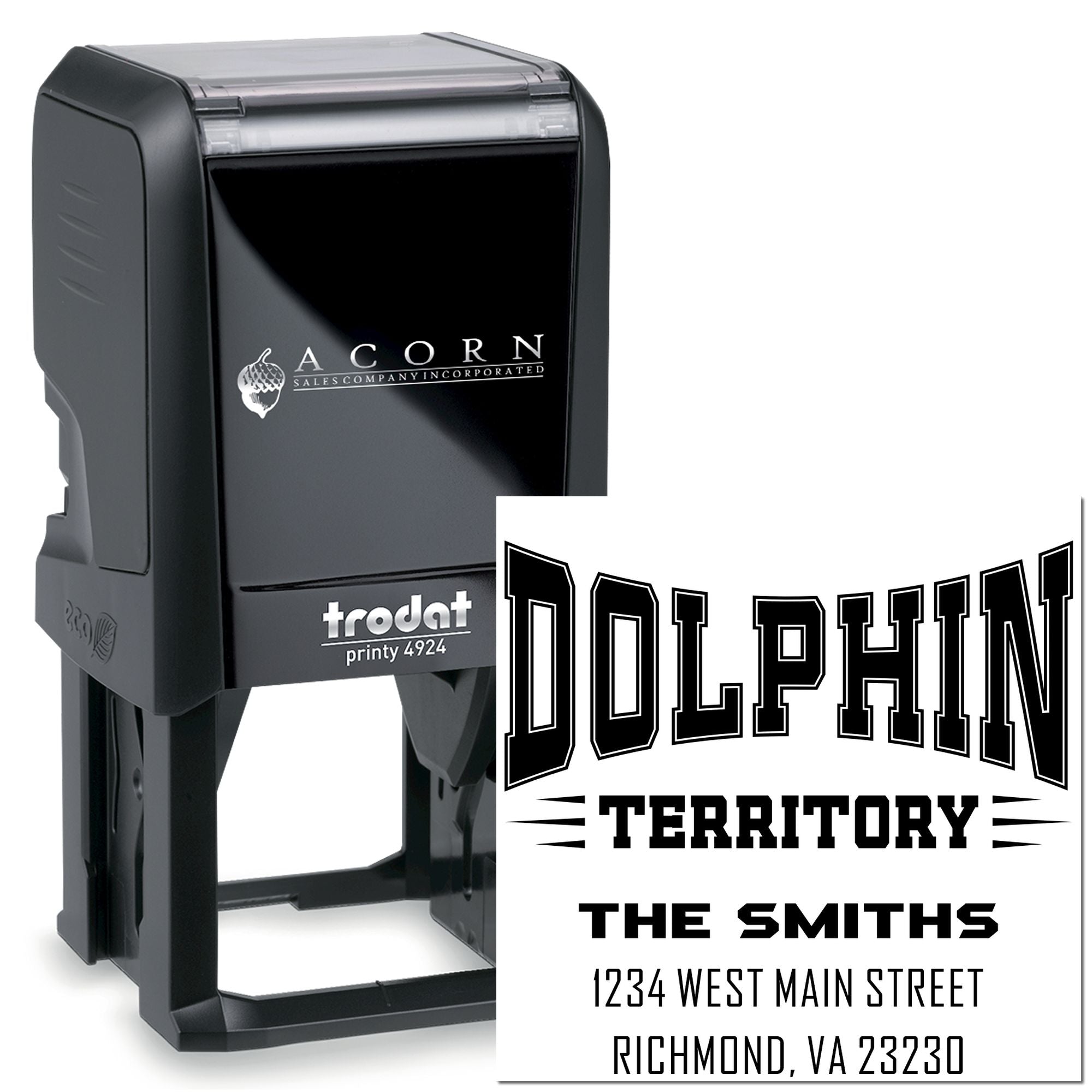 Trodat Printy 4924 self-inking rubber stamp showing a custom Dolphin Territory family address imprint.