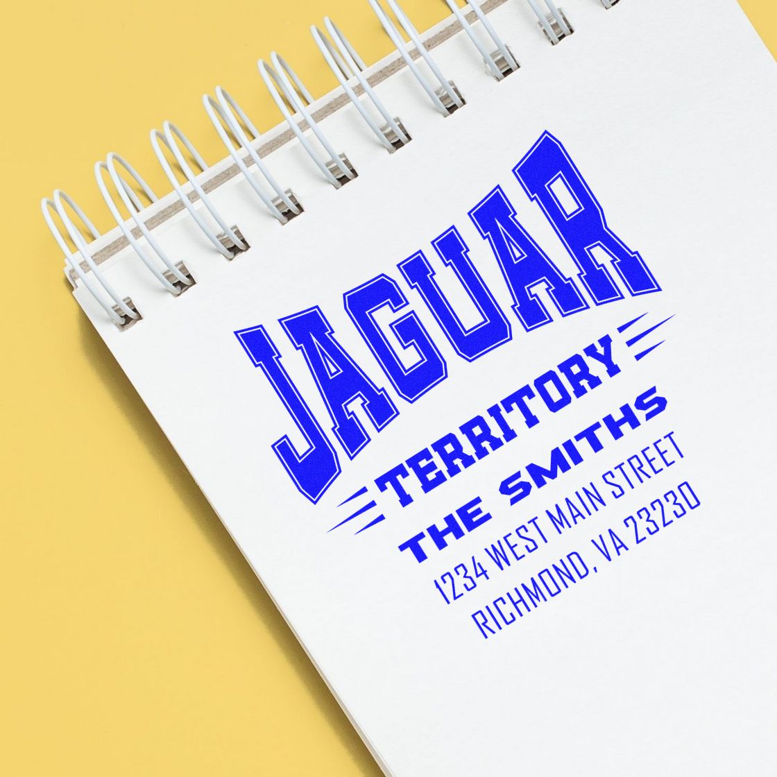Personalized address rubber stamp imprint for Jaguar Territory, The Smiths, with Richmond, VA address on a notebook cover.